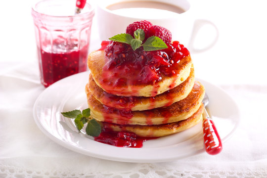 Pancakes with raspberry and peach coulis