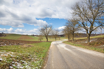 Fototapeta na wymiar Slovakia - The road in the spring country of Silicka Planina plateau.