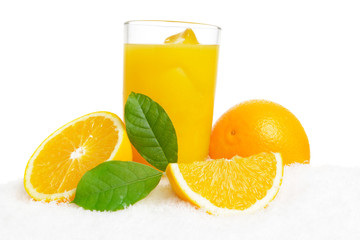 Orange juice,fruit,ice cubes and leaves on ice on white