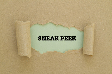 SNEAK PEEK word written under torn paper.