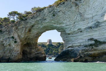 Fototapeta na wymiar The arch rock window near Vieste on Gargano