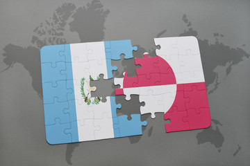 puzzle with the national flag of guatemala and greenland on a world map background.