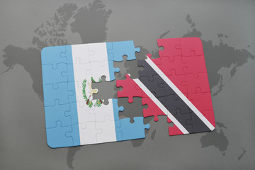 puzzle with the national flag of guatemala and trinidad and tobago on a world map background.
