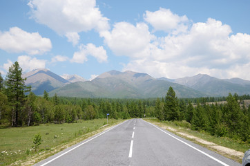 Naklejka premium Tarmac road leading to the Sayan Mountains