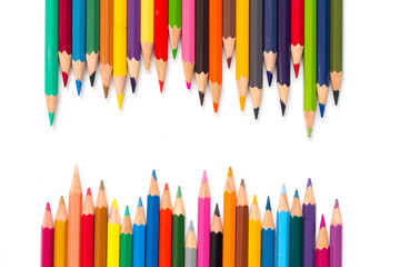 Row of color pencil placed on white background
