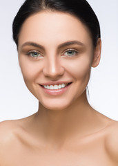 Beautiful Woman Face. Beauty Portrait.  Spa  smiling. Perfect Fresh Skin. Pure  Model Girl. Youth and  Care Concept. Brunette with Blue Eyes