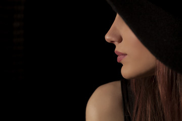 Fototapeta premium profile of woman with a hat