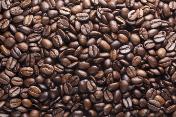 vibrant, dry, roasted coffee beans  background, top view, sullen 