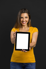 Woman holding and showing a tablet