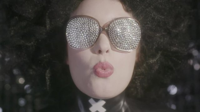 cool woman blowing bubblegum fetish latex