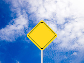 Blank yellow transportation sign on clear blue sky with white cl