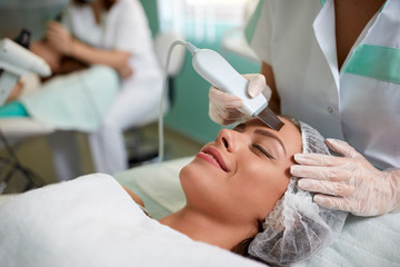 woman's face during cavitation peeling