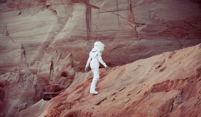 futuristic astronaut on another planet, image with the effect of toning