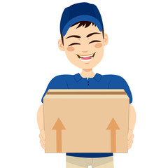 Happy young delivery man holding box delivering mail package