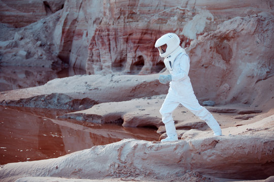 Water on Mars, futuristic astronaut, image with the effect of toning