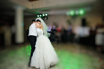 groom and bride dancing in restaurant