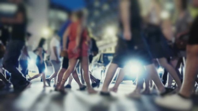 City pedestrians on hot summer night, cross street