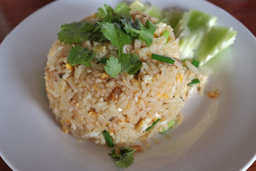 Thai fried rice with crab in white plate.