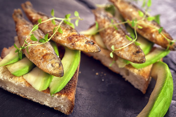 Sandwich with sprats and avocado