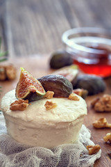 Ricotta with  ripe sliced fig fruits, nuts and honey copy space