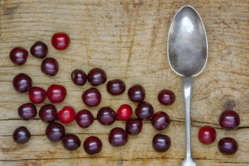 Cherry on the board and spoon