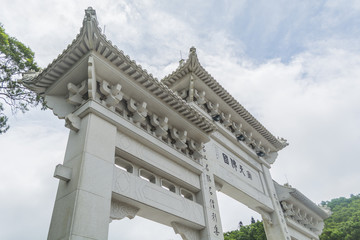 Fototapeta premium The white gate, an entrance to Tian Tan Buddha, at Ngong Ping, Hong Kong.