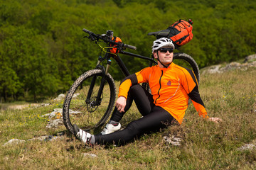 Fototapeta premium Young man is riding bicycle outside. Healthy Lifestyle.