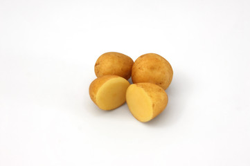 whole and sliced potatoes isolated