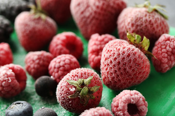 Frozen ripe strawberries, blueberries and raspberries