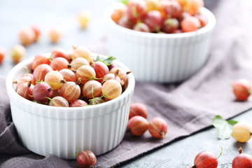 Gooseberries fruit on a grey table