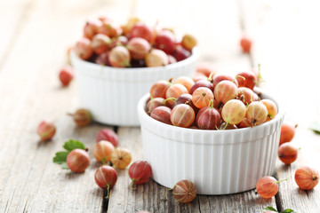 Gooseberries fruit on a grey wooden table