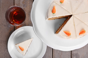 Delicious carrot cake with tea, closeup