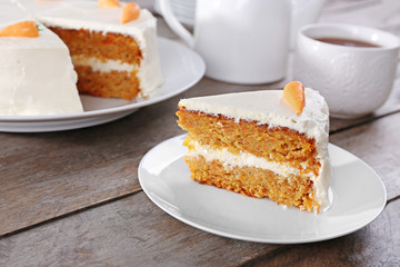 Delicious carrot cake on wooden table