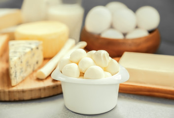 Mozzarella cheese in bowl on table