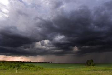 Thunder-storm over fields in rural areas