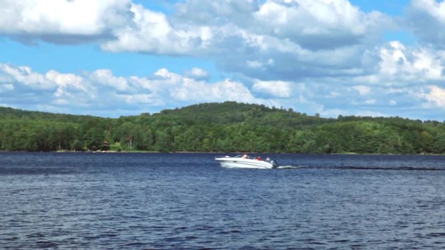 Speedboat on summertime lake. Helgasjon, Sweden.