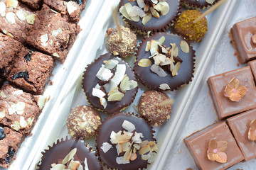 Muffins with coconut flakes, cakes with chocolate and caramel