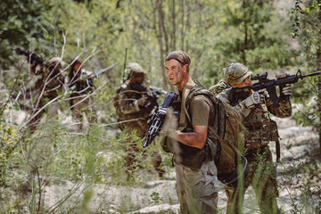 Fototapeta premium Special forces soldiers with weapon take part in military maneuv