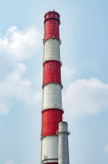Large Chimney On A Background Of Blue Sky