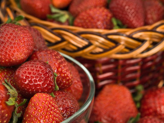 Strawberry in a glass vase and a basket