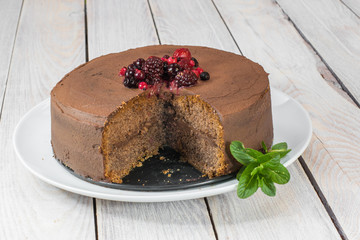 Sliced Chocolate cake with Ganache and berries fruit