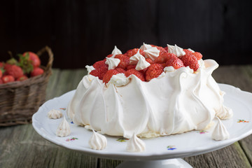 Strawberries Pavlova Cake with Whipped Cream on a White Plate