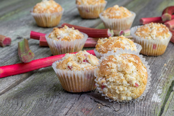 Rhubarb muffin with rhubarb petioles in the background