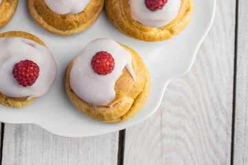 Detailed Top View on Raspberries Profiterole with White Chocolat
