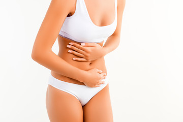 Close up of woman having abdominal pain or menstrual cramps