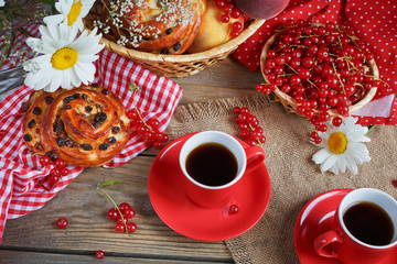 Fresh baked buns with a cup of coffee