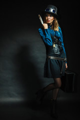 Steampunk girl with retro bag.