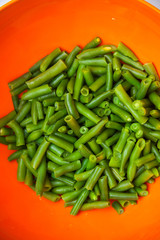 Cooked green beans with sesame seeds in frying pan