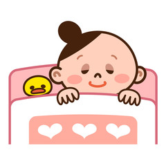 布団で寝る若い女性