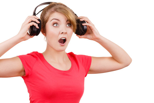 Woman in big headphones listening music isolated